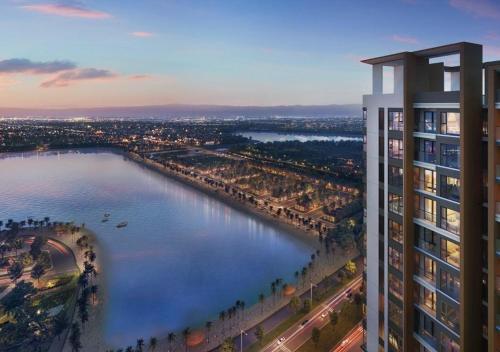 a rendering of a tall building next to a river at A Quiet Stay - Service Apartment, Vinhome Ocean Park, Ha Noi in Gia Lâm Pho