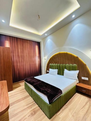 a bedroom with a large bed in a room at Hotel Cloud 9 in Amritsar