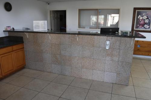 a kitchen with a tile counter top in a room at Corcoran Inn in Corcoran