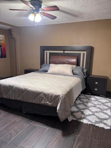 a bedroom with a bed and a ceiling fan at Casa Rosarito beach in Rosarito Beach