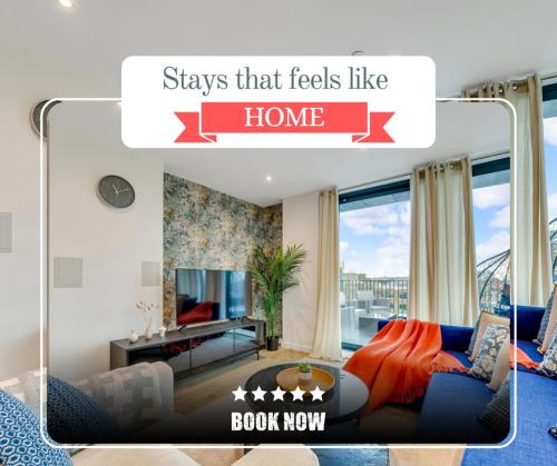 a living room with a blue couch and a tv at Last-Minute Grabs l Cozy Apt in Camden Town By Capital Retreats Short Lets & Serviced Accommodation London With Balcony, Free WiFi in London
