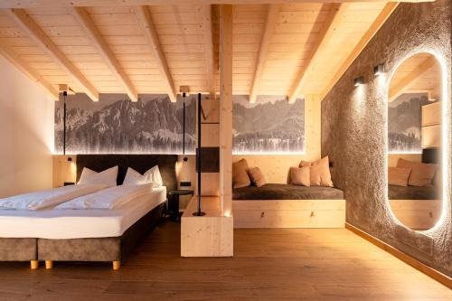 a bedroom with two beds in a room at Guest House Fleim in Panchià