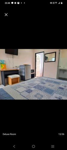 a picture of a bedroom with a bed at The Grove Guesthouse in Patong Beach