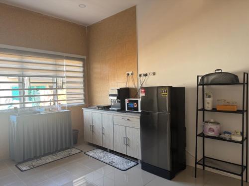 Cuina o zona de cuina de Harees Homestay
