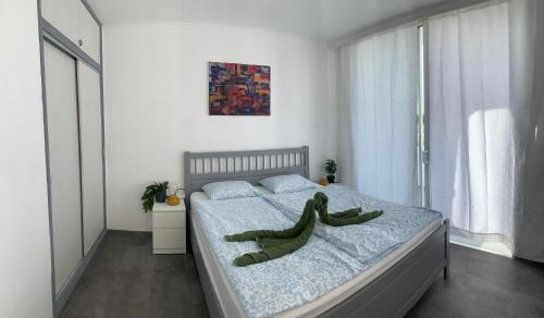 a bedroom with a bed with a stuffed animal on it at Pandora apartment in Las Galletas