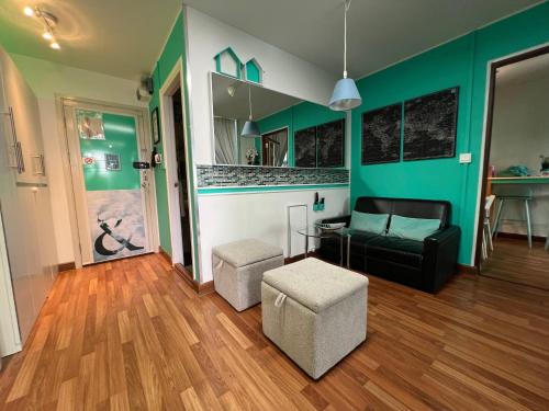 a living room with a couch and a chair at White Turquoise -1 Bedroom Apartment- in Bangkok