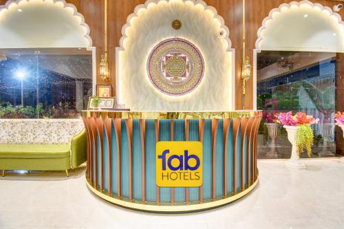a fico hoci sign on a table in a room at FabHotel Chhappan in Aurangabad