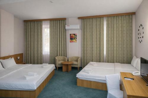 Llit o llits en una habitació de Hotel Expo