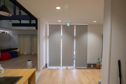a large sliding glass door in a living room at 里山ハウス in Kamogawa