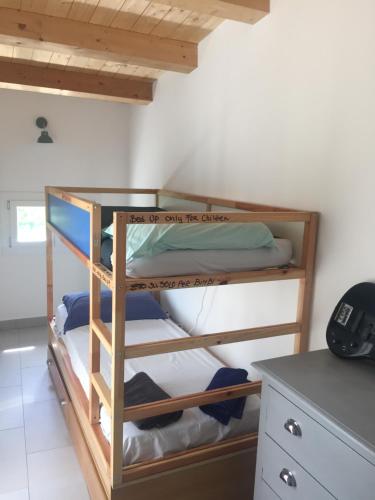 a bunk bed in a room with a desk at Casa Andrean PT Lido Venezia in Venice-Lido