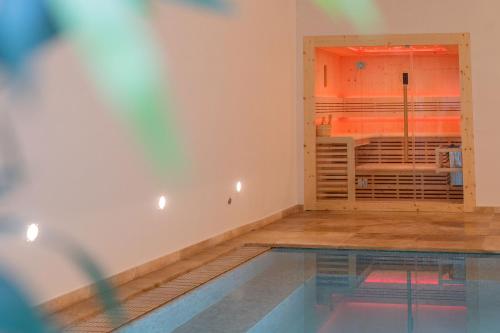 a room with a swimming pool and a room with a window at 224 Boutique Hostel in Sliema