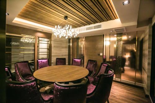 a conference room with a table and chairs at Arte Hotel - SHA Extra Plus in Bangkok