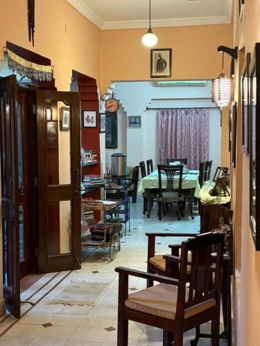 a room with chairs and a table in a room at Udai Niwas - Bikaner in Bikaner