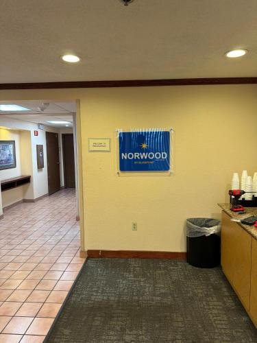 a lobby with a northword sign on a wall at Norwood Inn & Suites By BlissPoint in Indianapolis