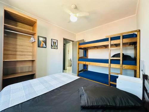 a bedroom with two bunk beds in it at Ap Aconchego 210 B in Ubatuba