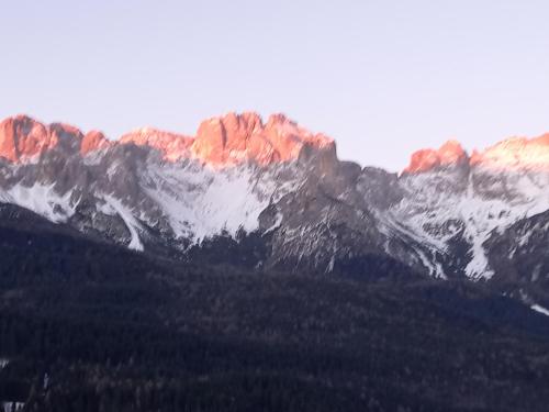 a group of mountains with snow on top of them at CasaInesAldo in Candide