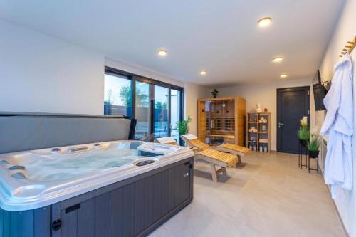 a large bathroom with a hot tub in the middle at Villa 7Eight Banjole in Banjole