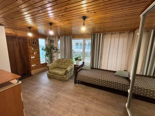 a living room with a couch and a chair at Gastehaus in Kostyantynivka