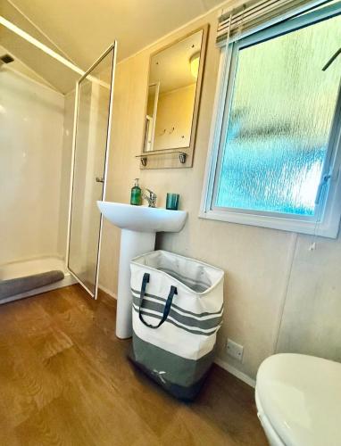 a small bathroom with a sink and a toilet at St Tropez Surprise in Gassin