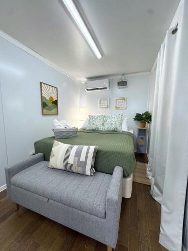 a bedroom with two beds and a couch at Villa Morivivi Couples with pool in Tierras Nuevas Poniente