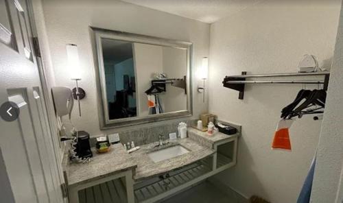 a bathroom with a sink and a mirror at Quality Inn & Suites Jasper - Kimball in Jasper