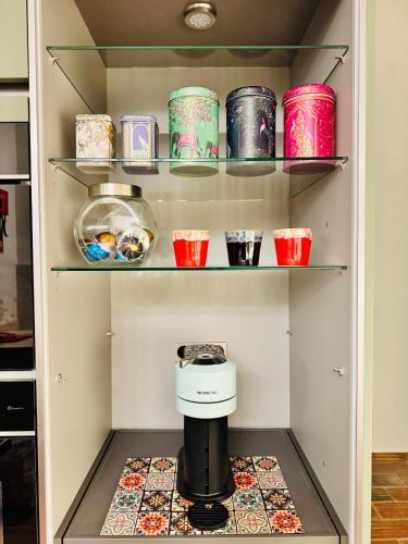 a kitchen pantry with a coffee maker in it at Casa da Parreira in Loulé