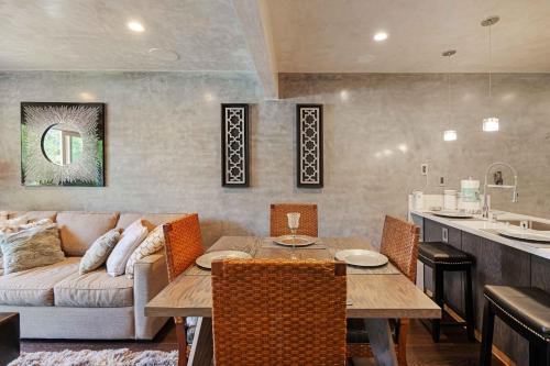a living room with a table and a couch at Luxury Condo Resort Amenities - Pool, Pickleball in San Diego