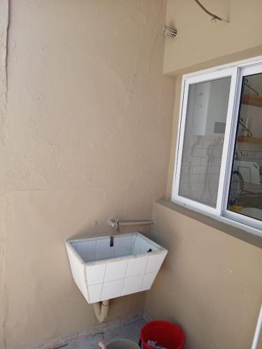 a bathroom with a sink and a window at Casa Esmeralda in Concordia