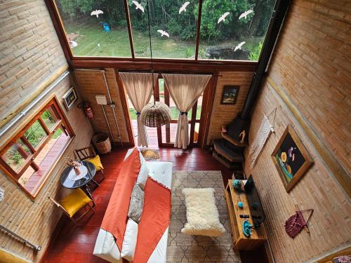 an overhead view of a living room with a large window at Recanto Curiaçu in Cunha