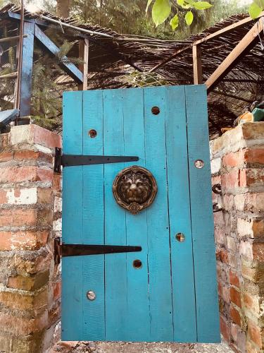 a blue door with a snail on top of it at Quiet countryside retreat in Cork