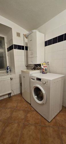 a washer and dryer in a room with at Chalupa U Bertholda in Červená Voda