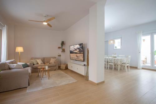 a living room with a couch and a table at Casa La Pedrera in Pedralba