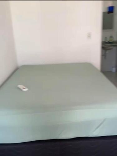 a large white bed in a room at Lagoa do Bonfim RN in Natal