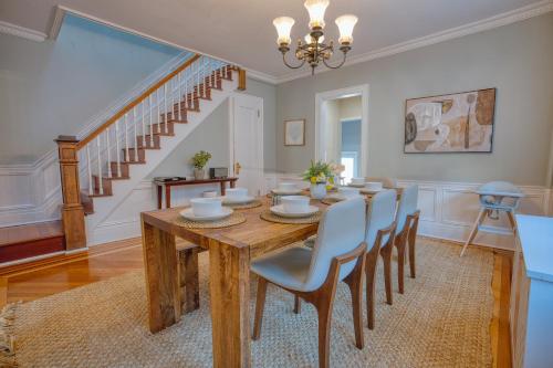 a dining room with a wooden table and chairs at Brooklyn Gem 3 Blocks to Prospect Park - 3 King Beds 1 Queen, Free parking, in Brooklyn