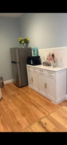 a kitchen with a white counter and a refrigerator at Fresh&Quiet One Bedroom Apartment in University City Walk to Drexel&Near UPenn in Philadelphia