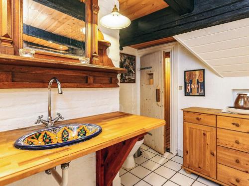 a kitchen with a sink and a counter top at 4 person holiday home in Asaa in Aså