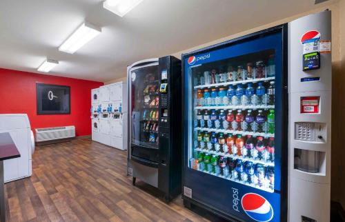 a soda machine in a store with soda bottles at Extended Stay America Select Suites - Jacksonville - Lenoir Avenue East in Jacksonville