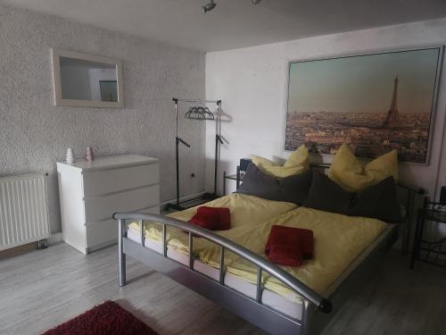 a bedroom with a bed with a view of a city at Ferienwohnung Silchmüller in Zella-Mehlis