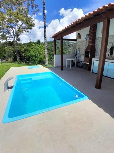 a swimming pool in the middle of a patio at Mansion in the mountains in Teresópolis