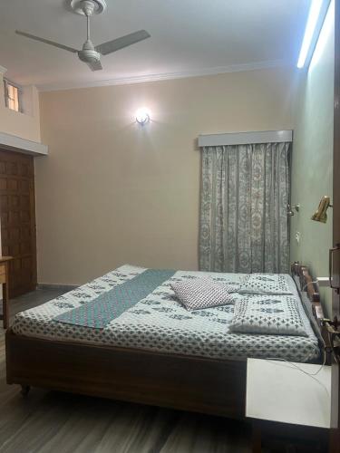 a bed in a bedroom with a ceiling at Smriti- loving memories in Jaipur