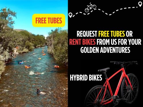 a red bike parked next to a river with people rafting at 10 min to Red Rocks & KING BED & 7min to I70 & DT Golden & STR-25-0009 in Golden