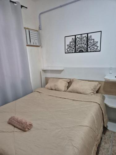 a bed in a small room with a bed sidx sidx sidx at Studio em Piedade in Rio de Janeiro