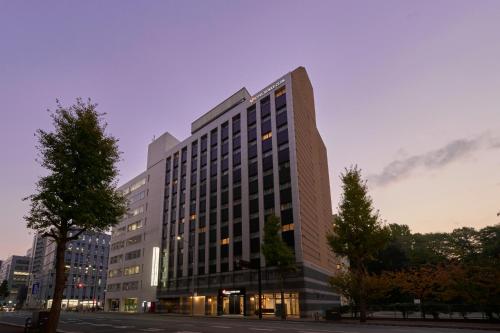 a large office building with a lot of windows at Hotel Hokke Club Fukuoka in Fukuoka