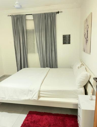 Katil atau katil-katil dalam bilik di Cozy Apartment