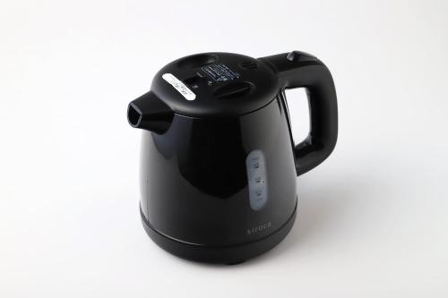 a black tea kettle on a white background at Smile Hotel Aomori in Aomori