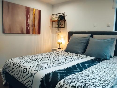 Llit o llits en una habitació de Le Ptit Lou