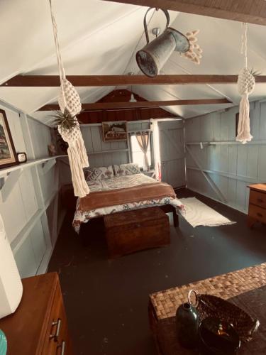 a room with a bed in a tent at Wech Cottage in Warkworth