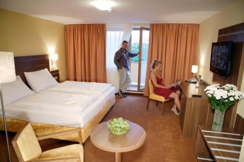 Postel nebo postele na pokoji v ubytování Wellness Resort Energetic