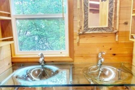 two sinks in a bathroom with a window at プールサイドヴィラ館山 in Tateyama