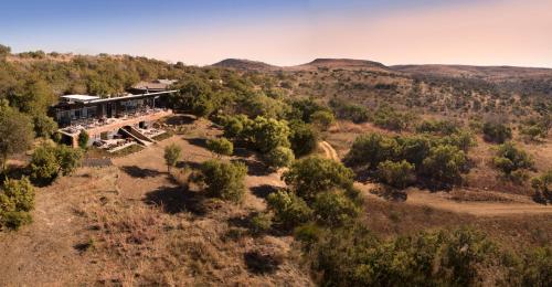 an aerial view of a building in the middle of a hill at Cradle Boutique Hotel in Lanseria